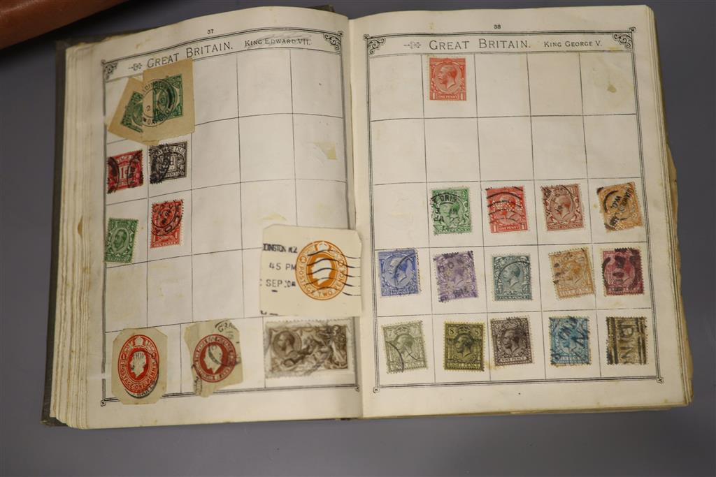 A Stanley Gibbons red stamp album and two others, each mounted with an accumulation of all world postage stamps
